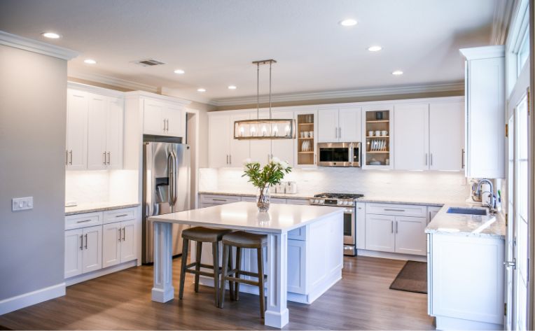 Large kitchen with island and wood look flooring